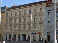 Trg bana Jelačića 12, kuća Živković današnji izgled dobila je 1876. godine. Ivan Plochberger st. projektirao je i izveo nadogradnju i novu fasadu na staroj jednokatnici